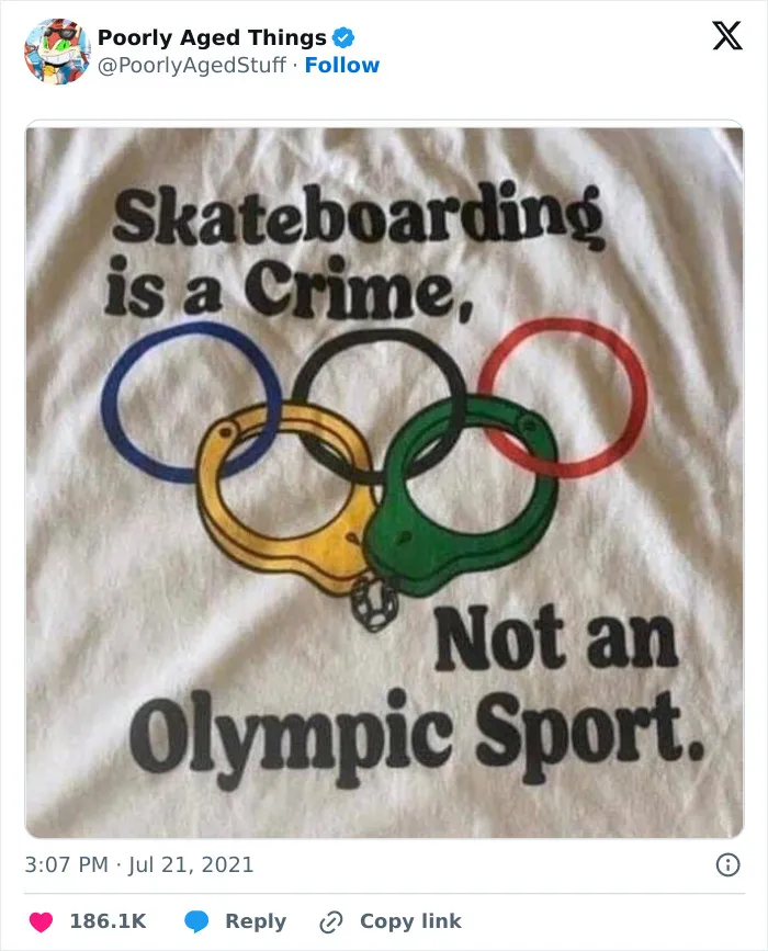 A white t-shirt with a graphic saying skateboarding is a crime and not an Olympic sport, showing poorly aged opinions.