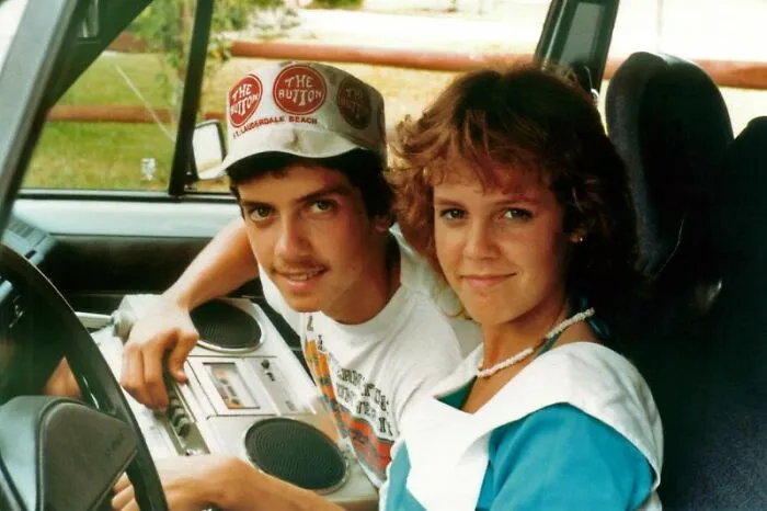 Boy And Girl In A Car With A Radio Cassette Player