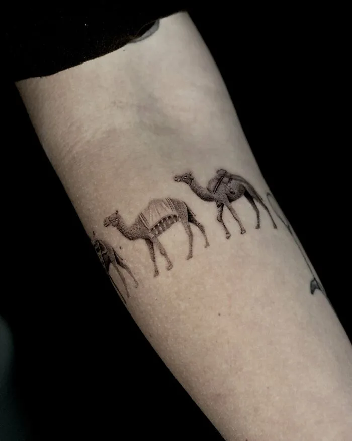 Minimalistic camel line tattoo around arm nature ink animal design