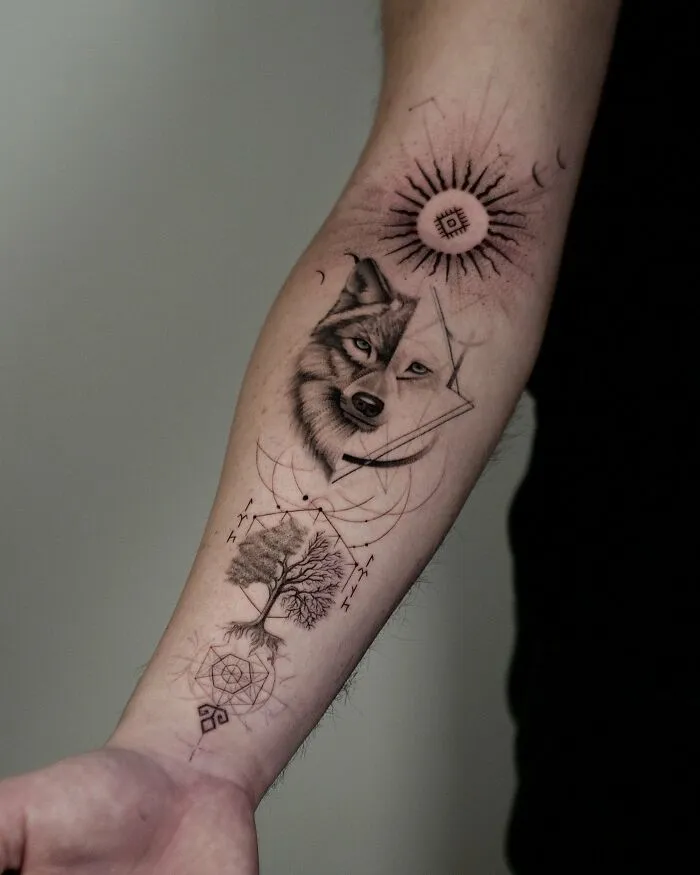 Wolf and tree geometric forearm tattoo with symbolic nature ink design
