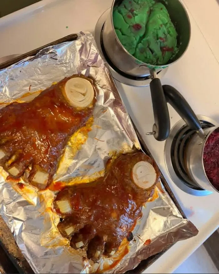 Meatloaf shaped like human feet on a baking sheet, illustrating odd food combinations.