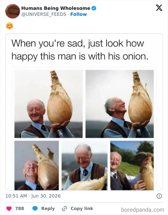 Happy man proudly holding and admiring a giant onion on his farm