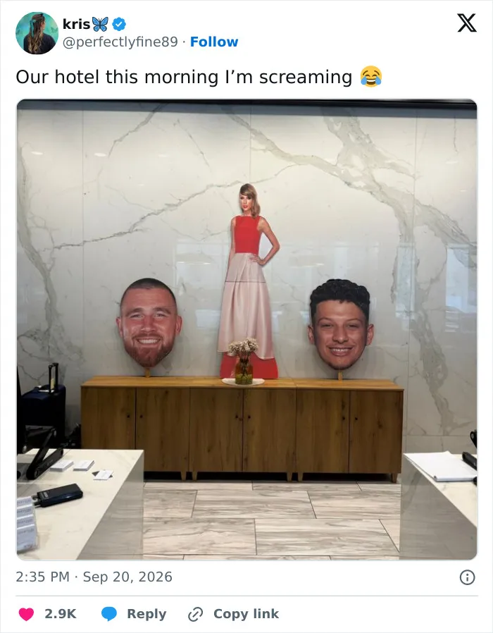 Hotel decorations showing a cutout of Taylor Swift between giant cutouts of Travis Kelce and Patrick Mahomes heads.