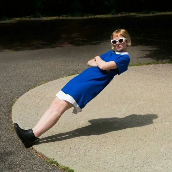 Unhinged image of a person seemingly floating mid-air, leaning against an invisible force with arms crossed.