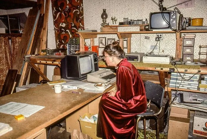 Woman Sitting By An Atari 800 Computer