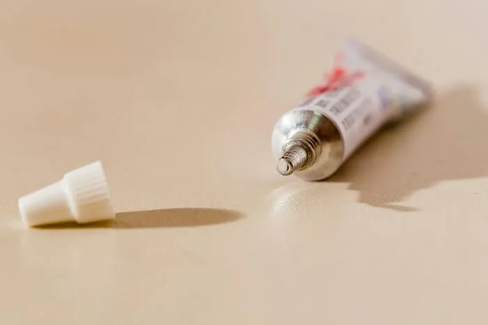 An open tube of ointment, often misused by strange patients with bizarre medical issues.