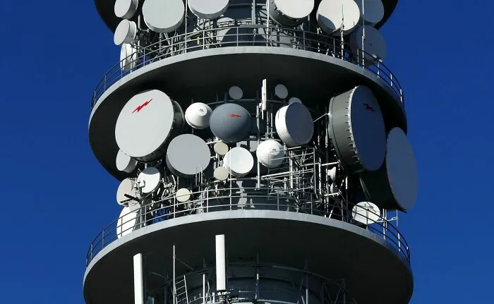 Broadcasting tower with many satellite dishes, introducing new facts about modern telecommunication systems