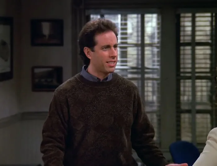 Jerry Seinfeld looking surprised on his show, illustrating an awkward celebrity encounter