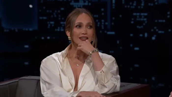 Singer and actress Jennifer Lopez resting her chin on her hand during a late-night talk show appearance