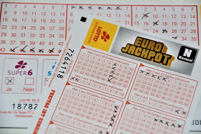 Euro Jackpot lottery tickets with marked numbers, representing ridiculous arguments in court.