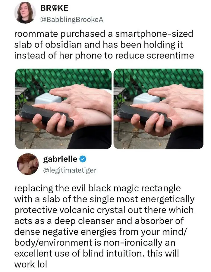Person holding a smartphone-sized slab of obsidian to reduce screentime