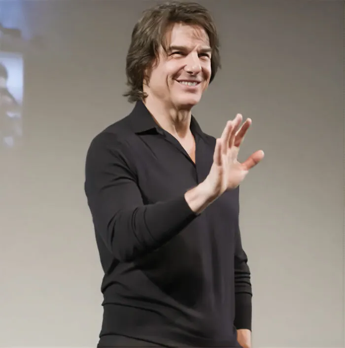 Tom Cruise smiling and waving, embodying the glamorous image of Hollywood and its underlying secrets.