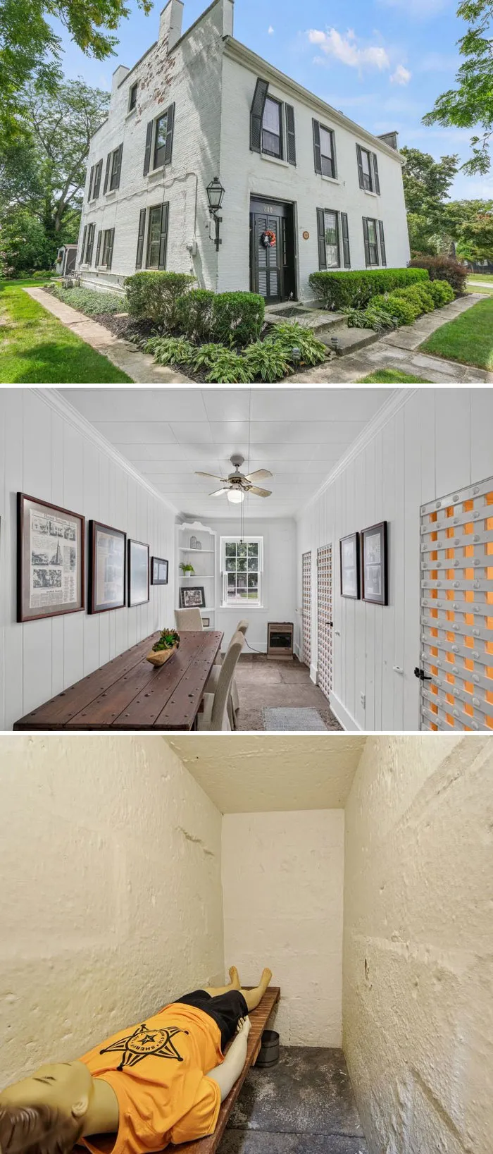 An unusual historic white building with a bizarre narrow dining area and jail cell from Zillow Gone Wild