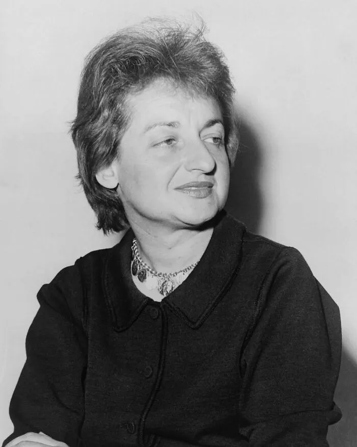 A black and white portrait of Betty Friedan, a woman in history.