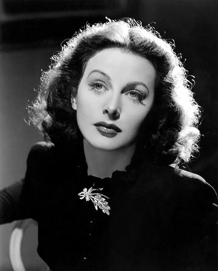 A black and white portrait of Hedy Lamarr, an actress and inventor, a woman in history.