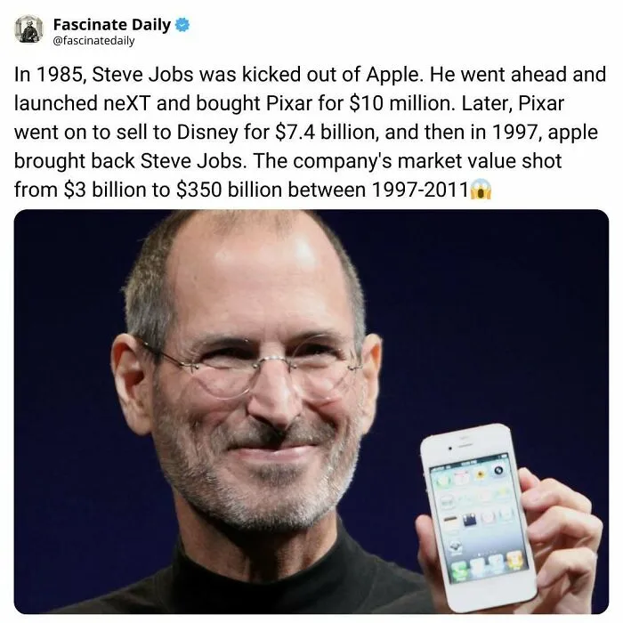 Steve Jobs holding iPhone after returning to Apple and Pixar success
