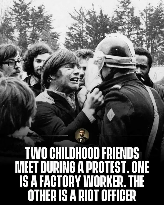 A black and white photo from history depicting two childhood friends meeting during a protest in a tense standoff