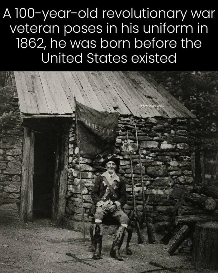 A 100-year-old revolutionary war veteran posing in uniform, showing photos from history