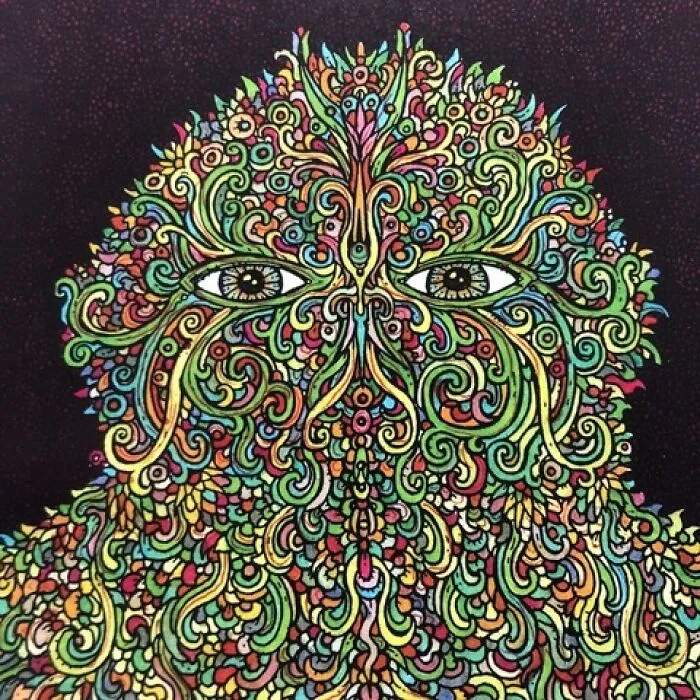 Intricate colorful face composed of swirling patterns and eyes by Theo Ellsworth