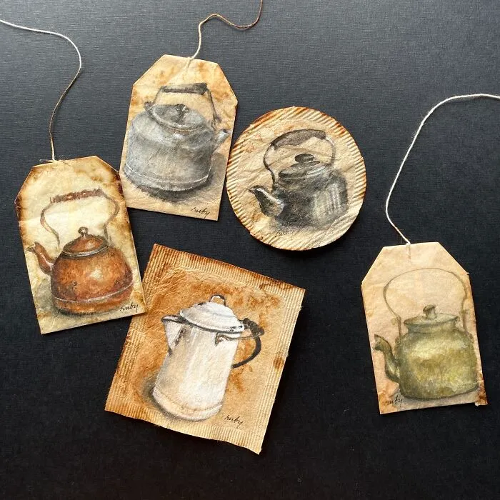 Various vintage teapots depicted in miniature paintings on used tea bags