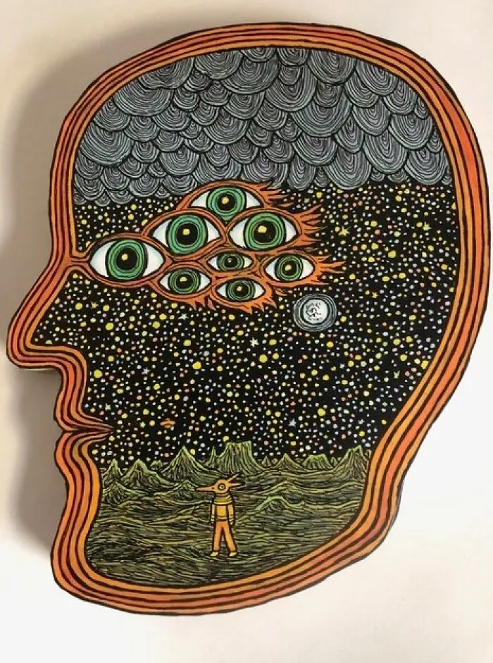 Theo Ellsworth surreal drawing of a head filled with stars, green eyes, and a small figure in a landscape