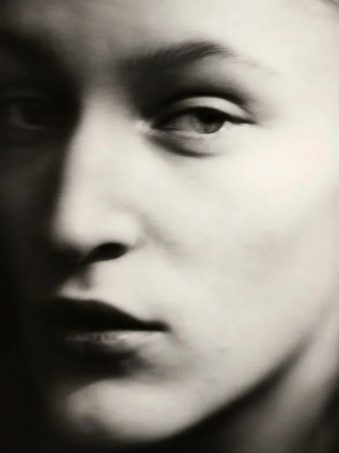 Close-up black and white portrait showcasing analog film photography details