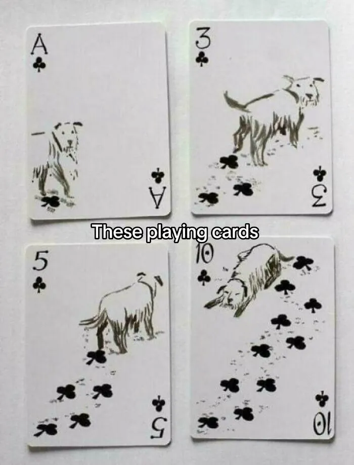 Playing cards featuring dogs with paw print trails