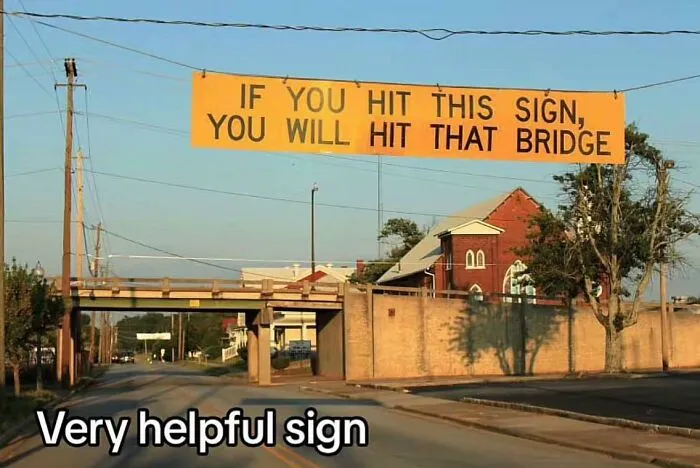 Creative sign warning drivers about hitting a low bridge to prevent accidents