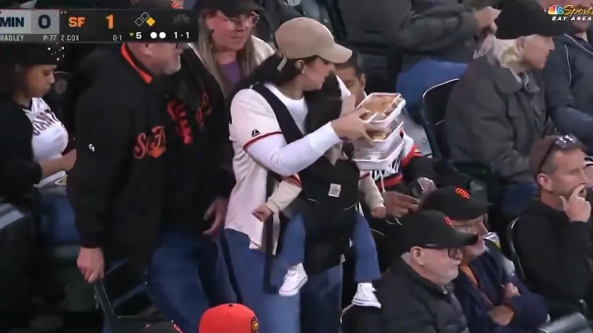 A Giants Game Camera Finds Mom Carrying Baby And Food, But The Dad Sitting Nearby Gets Attention