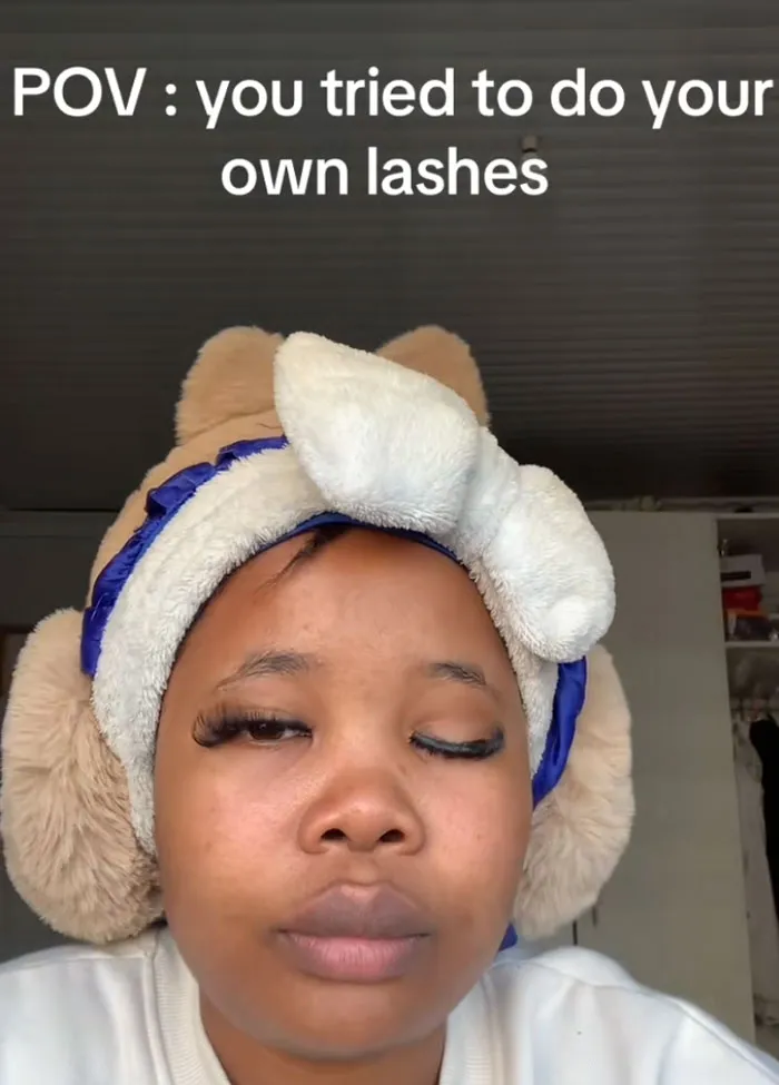 Woman with a glued-shut eye and messy DIY eyelashes highlighting beauty procedures fails