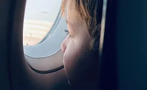 Woman Pays For Window Seat On Airplane, Baffled When She Finds A Kid Already In It