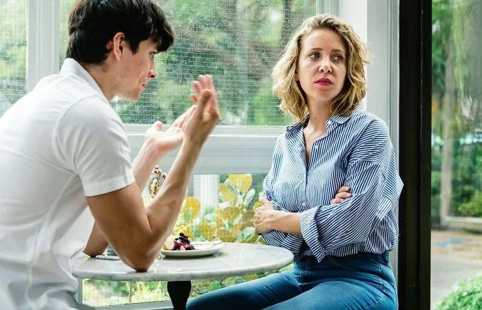 Couple having tense conversation showing clever insults in relationship context