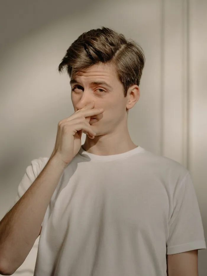 A man gesturing disgust, showing how certain behaviors make men lose interest