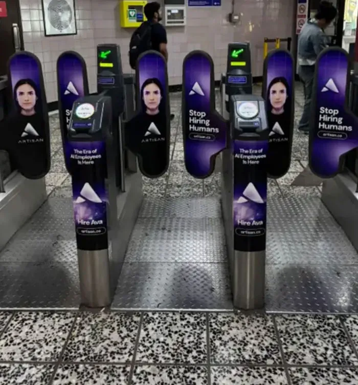 Subway turnstiles with ads saying Stop Hiring Humans, showcasing a dystopian American dream of automation.