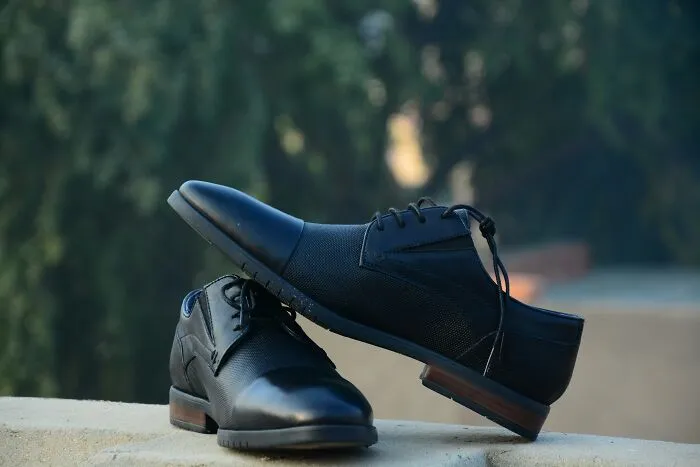 A pair of black formal shoes, symbolizing split and divorce division of property