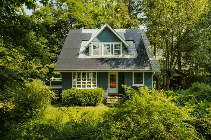 A beautiful house surrounded by green trees, a major asset during a split