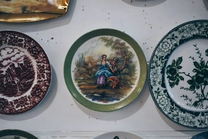 Decorative ceramic plates hanging on a wall, symbolizing disputes handled by divorce lawyers