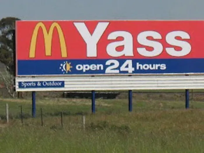 Large McDonald's billboard with the word Yass on it as an unusual sign from around the world.