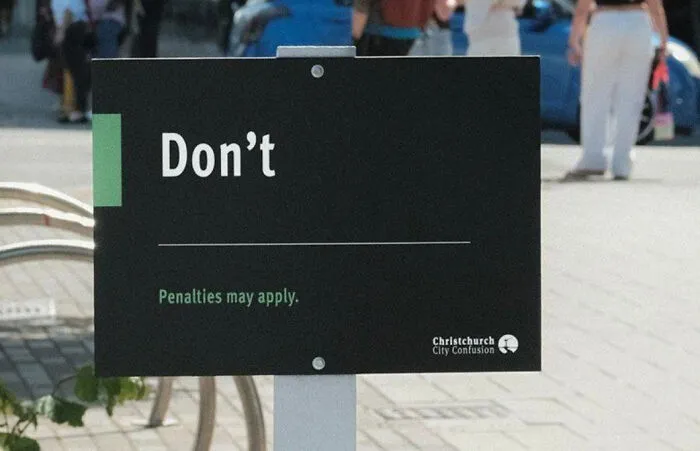 A black public sign that simply reads Don't, illustrating funny mistakes on signs