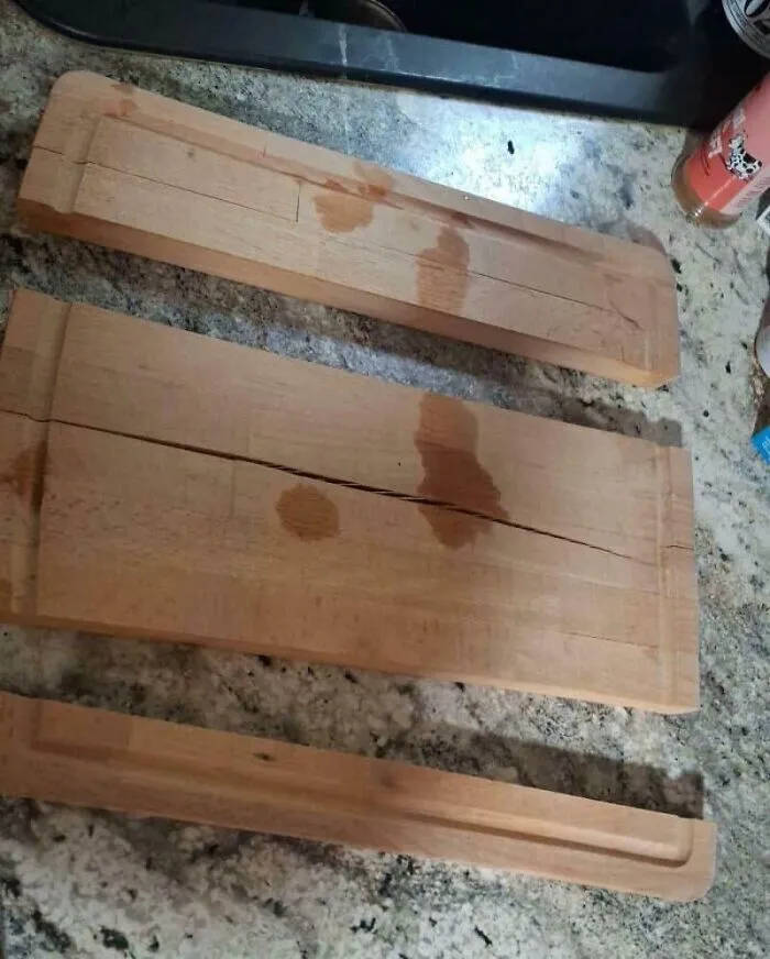 Three wooden cutting boards with cracks and water stains, demonstrating unfortunate kitchen fails.