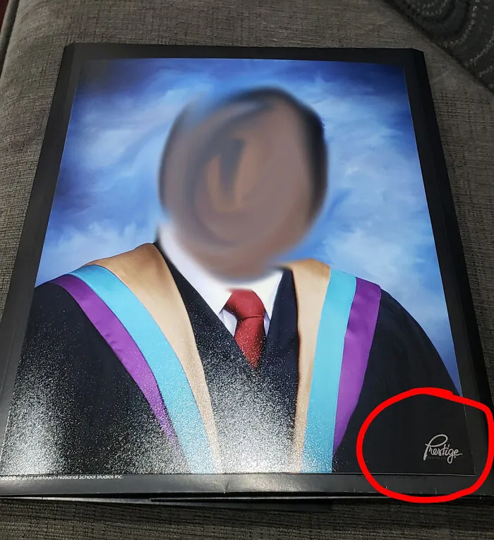 A graduation portrait with a misplaced company logo showing terrible product design