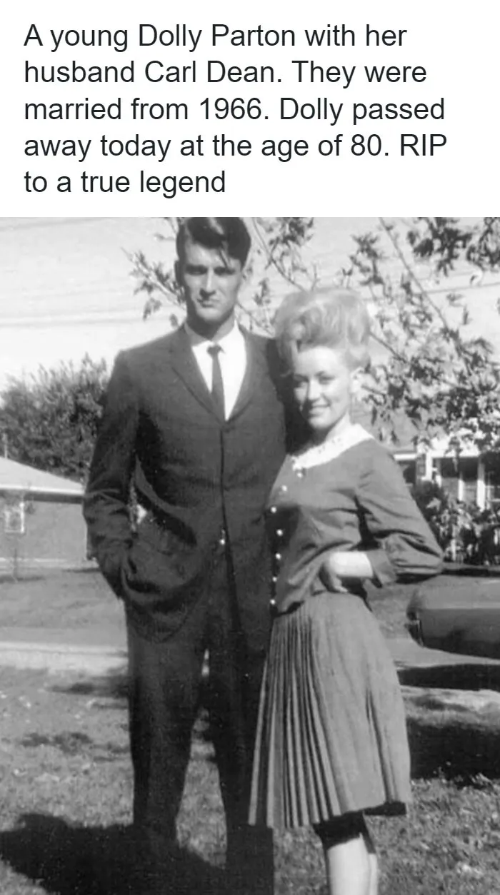 An archival black and white photograph of Dolly Parton and her husband Carl Dean standing together in their youth.