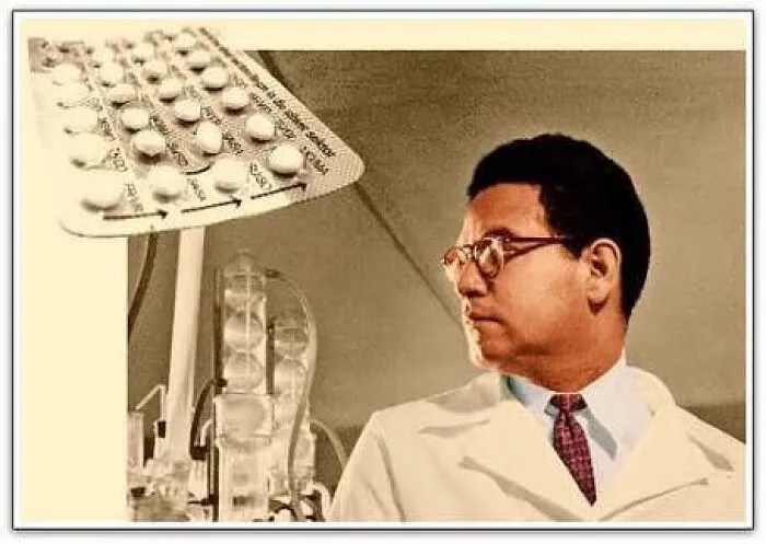 Scientist in a lab coats and glasses near birth control pills from medical history