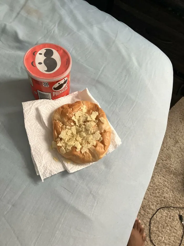Unusual food combinations of crushed potato chips sprinkled on top of a soft pastry roll