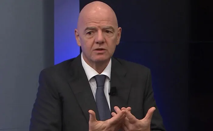 FIFA President Gianni Infantino speaking, illustrating industry secrets in sports businesses