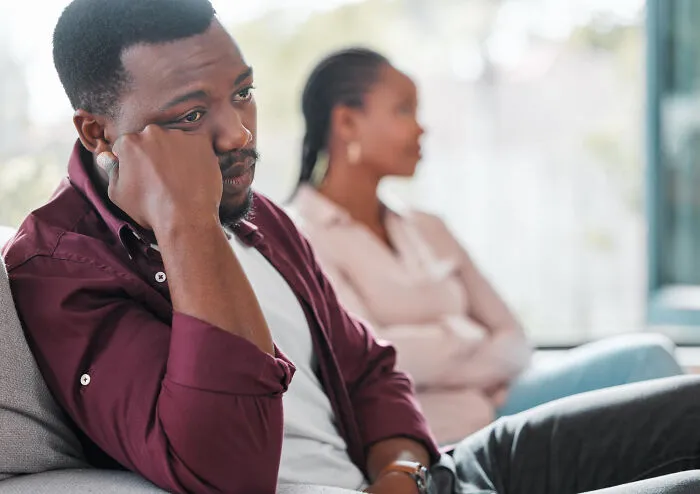 Man looking distant during couple's conflict showing toxic boyfriend traits