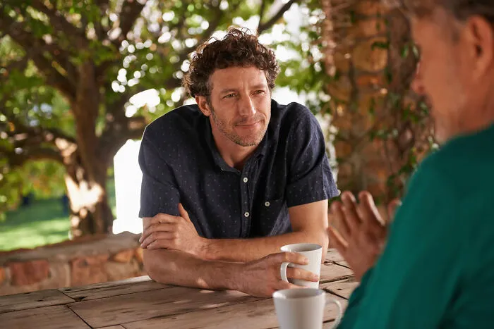 Man reflecting while having serious conversation about toxic love traits