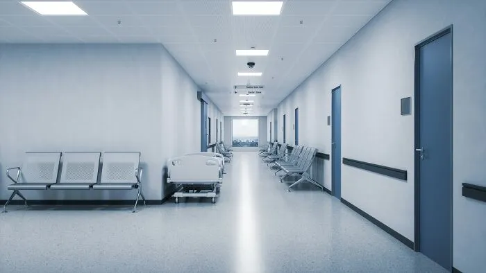 An empty hospital hallway where medical workers share stories