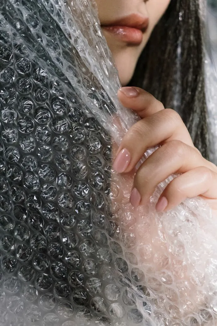 A woman holding bubble wrap, useful facts in an emergency