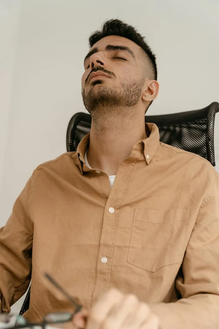 Man resting in a chair with eyes closed, illustrating stress relief facts that could make a huge difference in an emergency